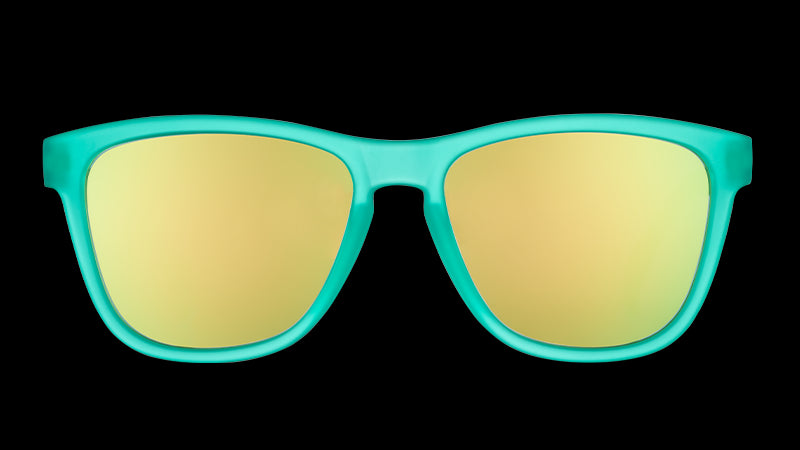 Vista frontal de unas gafas de sol cuadradas de color verde azulado con cristales espejados de color verde azulado.
